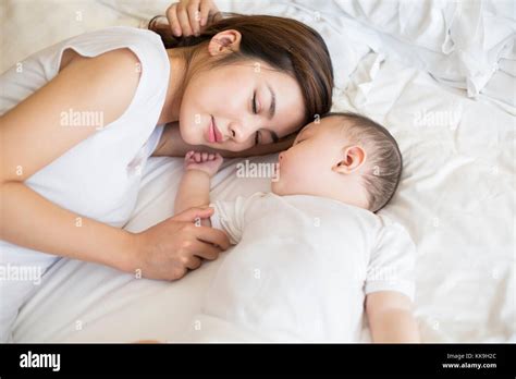 Mother And Son Sleeping In Bed stock videos and。